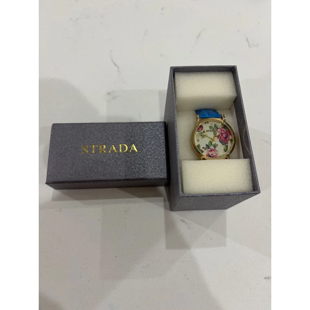 Strada Womens Floral Dial Gold Tone Watch Blue Croc Embossed Strap with Box